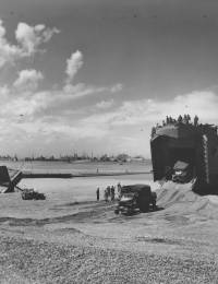 LST_Ship_Unloading_Trucks_D-Day_Beach_Normandy_1944